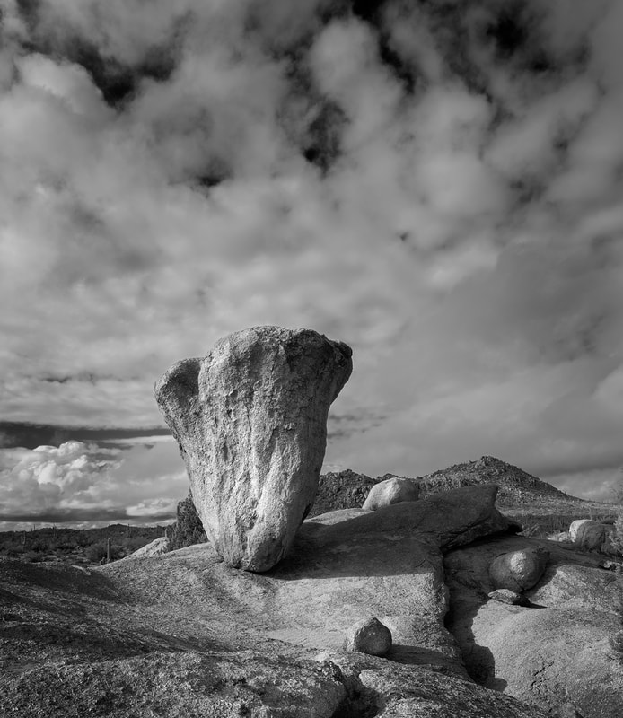 Black and White image of a large granite balanced bounder