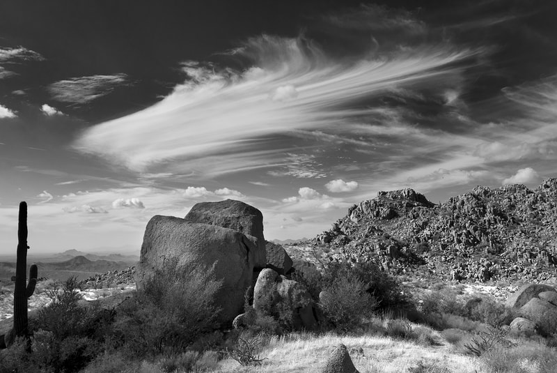 Black and White image of rock formation and cirrus clouds, AZ